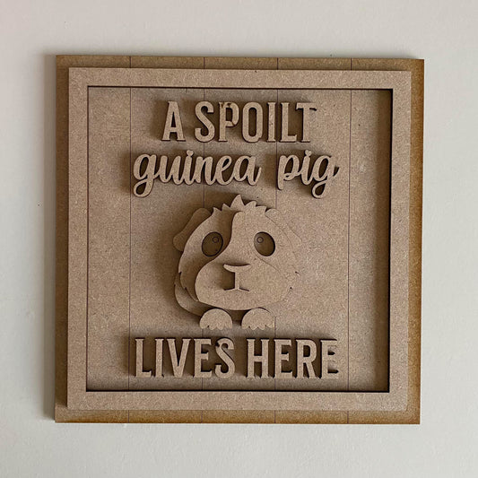19cm A Spoilt Guinea Pig Lives Here Sign