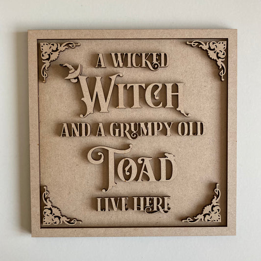 19cm A Wicked Witch And A Grumpy Old Toad Live Here Sign