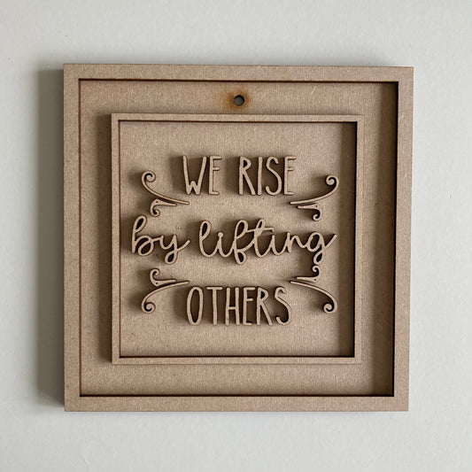 15cm We Rise By Lifting Others Sign